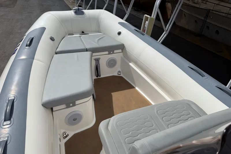  Yacht Photos Pics 2023 Williams Jet Tenders Dieseljet 625 interior with cushioned seating and speakers.
