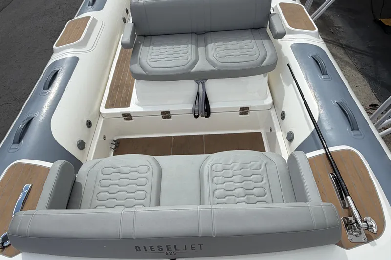  Yacht Photos Pics 2023 Williams Jet Tenders Dieseljet 625 interior with gray seating and wood accents.