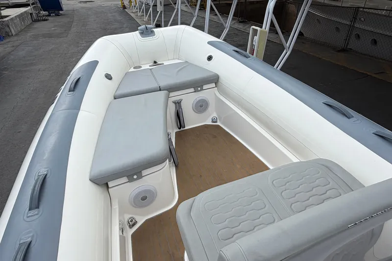  Yacht Photos Pics 2023 Williams Jet Tenders Dieseljet 625 interior with gray seating and wooden floor.