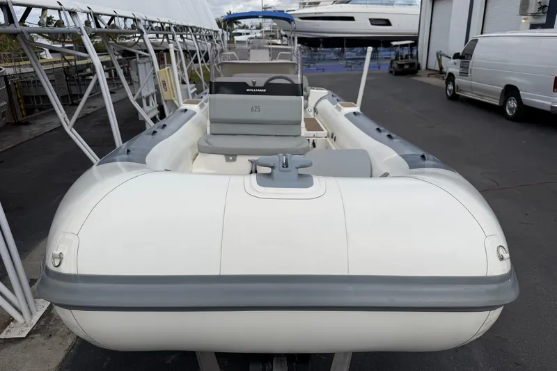  Yacht Photos Pics 2023 Williams Jet Tenders Dieseljet 625 inflatable boat docked at a marina.