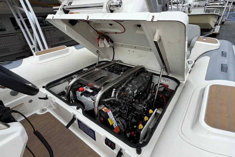  Yacht Photos Pics 2023 Williams Jet Tenders Dieseljet 625 engine compartment with open hatch, showcasing detailed mechanics.