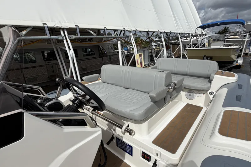  Yacht Photos Pics 2023 Williams Jet Tenders Dieseljet 625 with sleek seating and modern steering console.