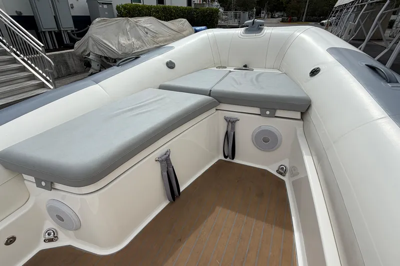  Yacht Photos Pics 2023 Williams Jet Tenders Dieseljet 625 interior with cushioned seating and speakers.