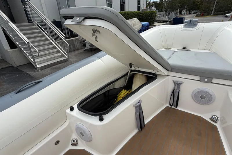  Yacht Photos Pics 2023 Williams Jet Tenders Dieseljet 625 with open storage compartment and seating area.