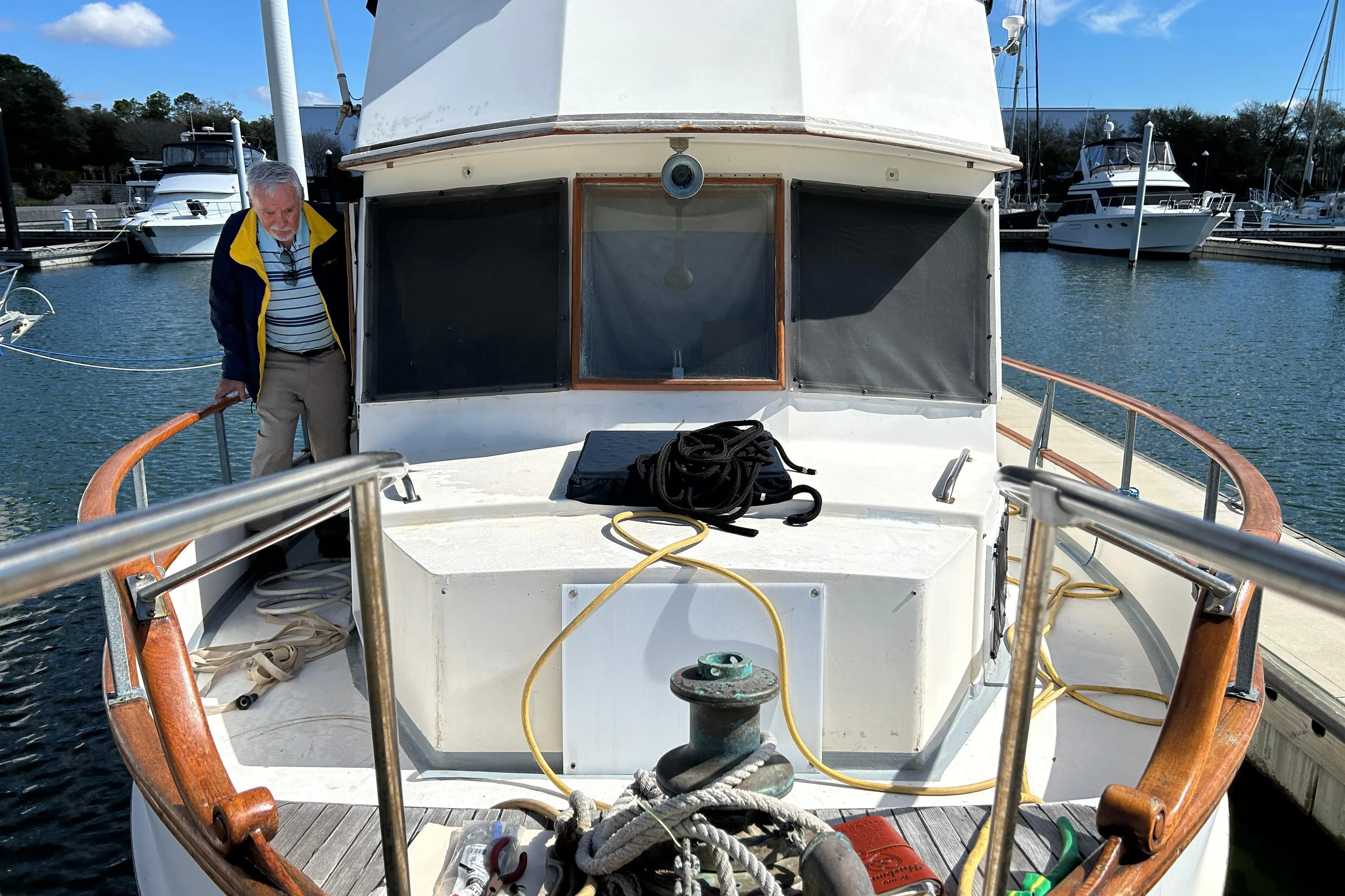 1988 Grand Banks 36 Classic yacht docked at marina with person on deck.