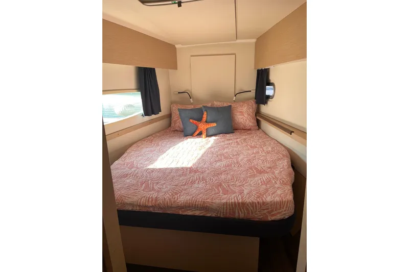 Akua Yacht Photos Pics Cozy cabin interior of 2018 Fountaine Pajot Helia 44 Evolution with decorative bedding.