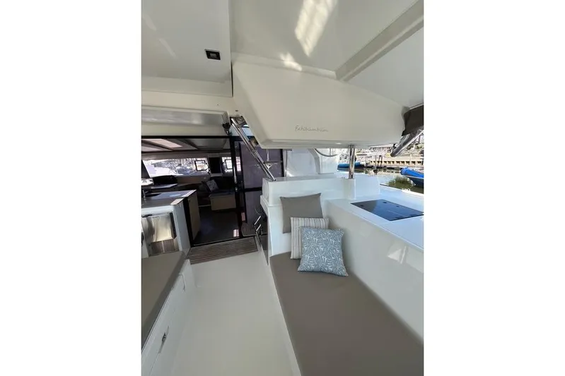 Akua Yacht Photos Pics 2018 Fountaine Pajot Helia 44 Evolution yacht interior with seating and cushions.