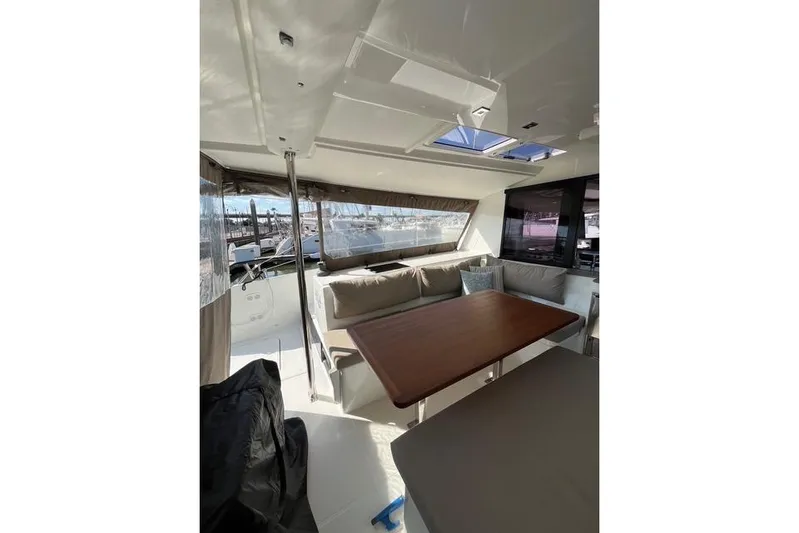 Akua Yacht Photos Pics 2018 Fountaine Pajot Helia 44 Evolution yacht interior with dining area and large windows.
