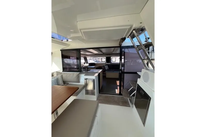 Akua Yacht Photos Pics Interior of 2018 Fountaine Pajot Helia 44 Evolution catamaran, featuring modern seating and dining area.