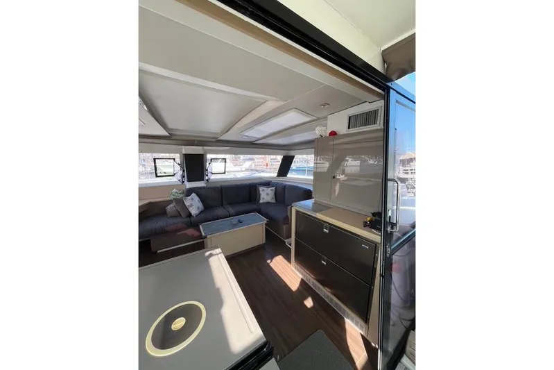 Akua Yacht Photos Pics Luxurious interior of 2018 Fountaine Pajot Helia 44 Evolution catamaran with modern furnishings.