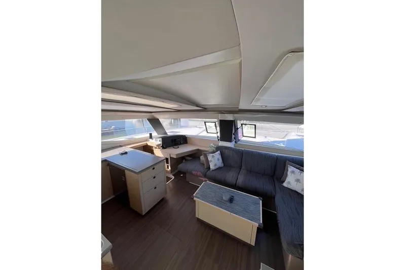 Akua Yacht Photos Pics Interior of 2018 Fountaine Pajot Helia 44 Evolution catamaran, featuring modern seating and navigation area.