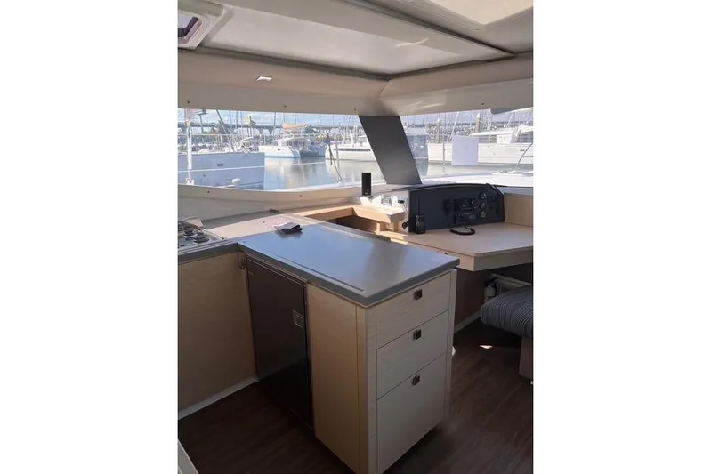Akua Yacht Photos Pics Interior of 2018 Fountaine Pajot Helia 44 Evolution catamaran, featuring modern kitchen and navigation area.