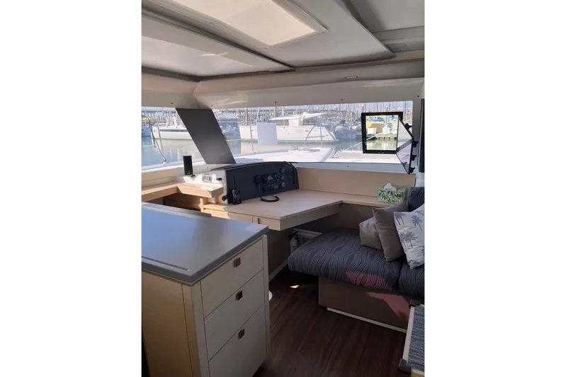 Akua Yacht Photos Pics Interior of 2018 Fountaine Pajot Helia 44 Evolution catamaran, featuring navigation station and seating area.