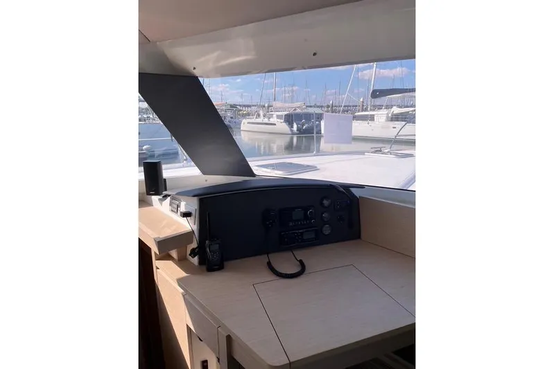 Akua Yacht Photos Pics Helm of 2018 Fountaine Pajot Helia 44 Evolution catamaran with marina view.