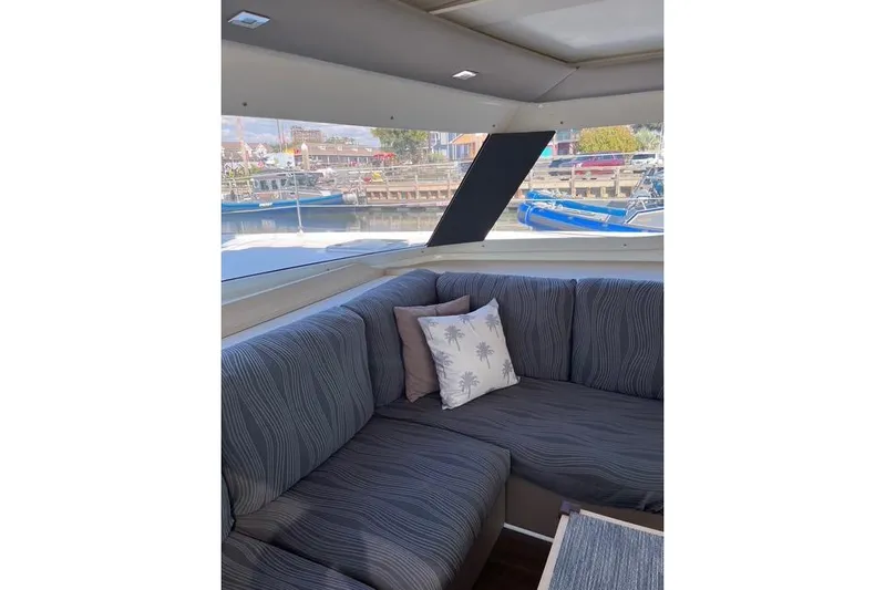 Akua Yacht Photos Pics Interior of 2018 Fountaine Pajot Helia 44 Evolution with cozy seating and decorative pillows.