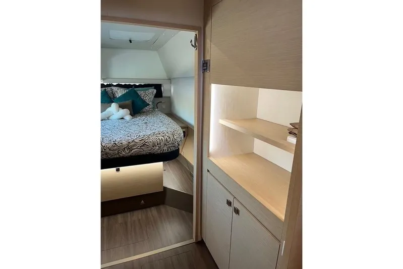 Akua Yacht Photos Pics Interior of 2018 Fountaine Pajot Helia 44 Evolution catamaran, featuring cozy bedroom and storage.