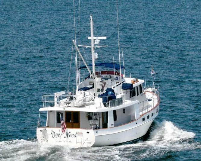 Dyer Need Yacht Photos Pics Kadey-Krogen 48 yacht from 1996 cruising on open water, rear view.