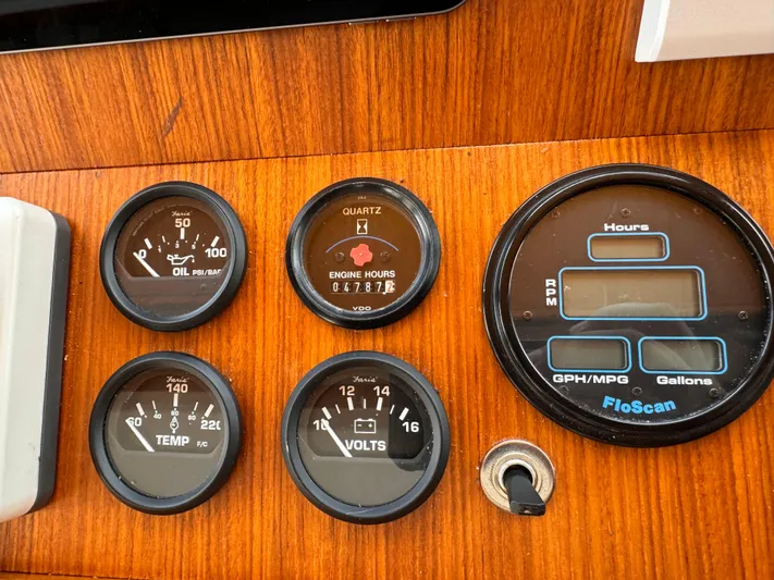 Dyer Need Yacht Photos Pics Instrument panel of a 1996 Kadey-Krogen 48, featuring oil, engine hours, temperature, and voltage gauges.