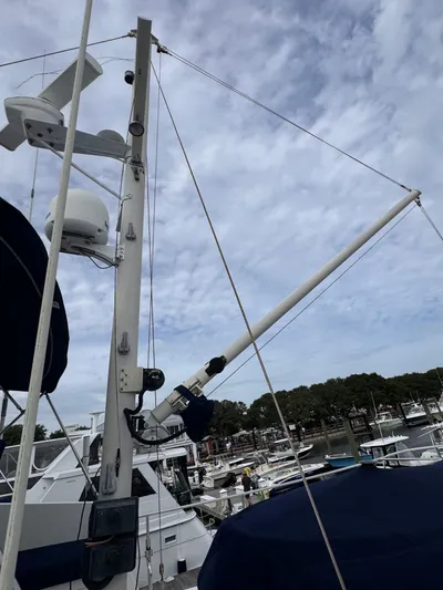 Dyer Need Yacht Photos Pics Kadey-Krogen 48 yacht mast and rigging, 1996 model, docked under cloudy sky.