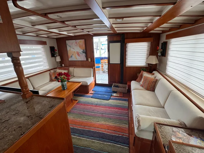 Dyer Need Yacht Photos Pics Luxurious 1996 Kadey-Krogen 48 yacht interior with cozy seating, colorful rug, and elegant decor.