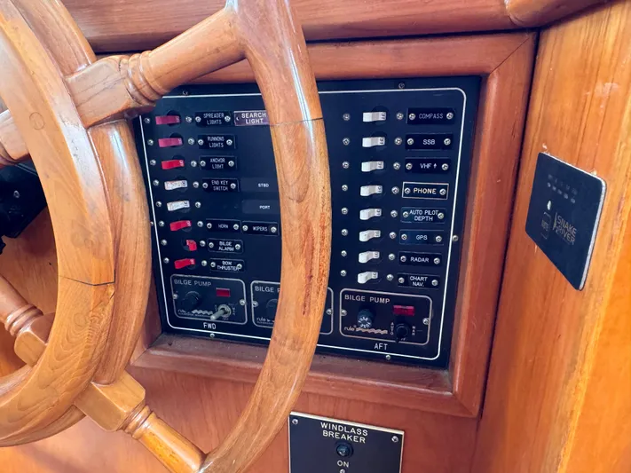 Dyer Need Yacht Photos Pics Control panel and wooden wheel of a 1996 Kadey-Krogen 48 boat.