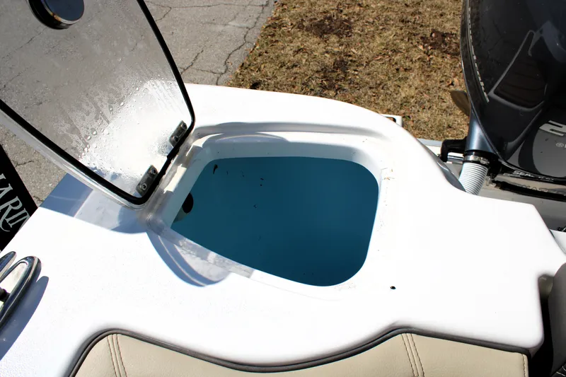  Yacht Photos Pics Open hatch on 2022 Tidewater 272 CC Adventure boat, showcasing interior compartment.