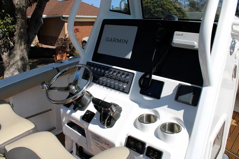  Yacht Photos Pics 2022 Tidewater 272 CC Adventure boat console with Garmin navigation system.