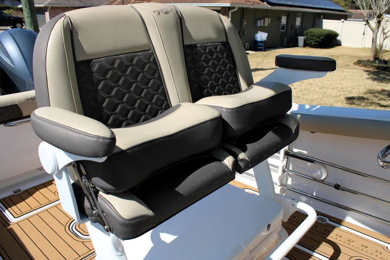  Yacht Photos Pics 2022 Tidewater 272 CC Adventure boat seating with cushioned armrests and stylish design.