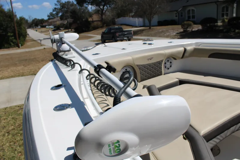  Yacht Photos Pics 2022 Tidewater 272 CC Adventure boat with trolling motor and cushioned seating.