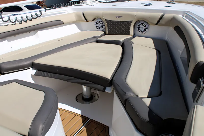  Yacht Photos Pics 2022 Tidewater 272 CC Adventure boat interior with cushioned seating and modern design.