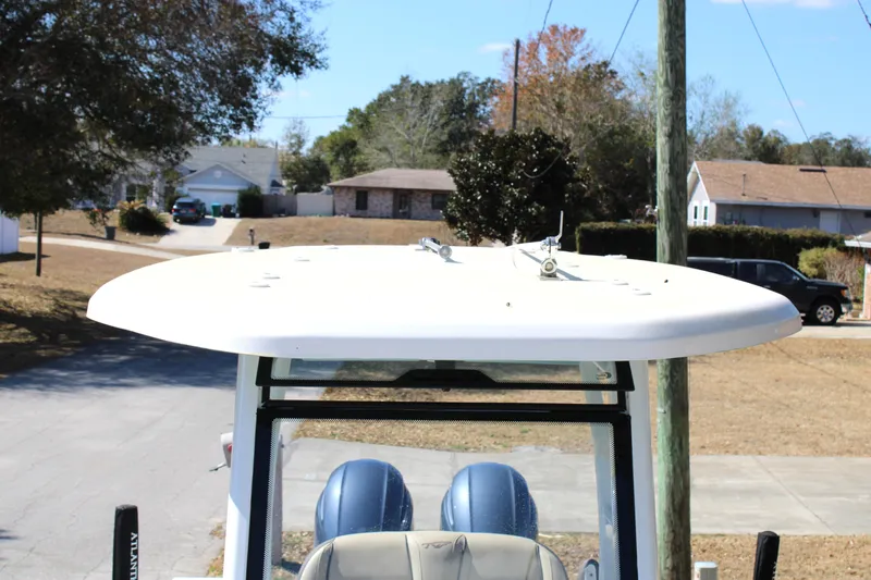  Yacht Photos Pics 2022 Tidewater 272 CC Adventure boat with T-top in a suburban setting.