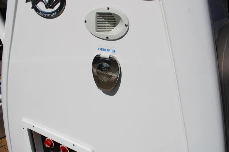  Yacht Photos Pics 2022 Tidewater 272 CC Adventure boat with fresh water access panel.