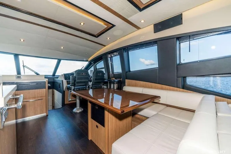  Yacht Photos Pics Luxurious interior of 2017 Sea Ray L650 Fly yacht with modern seating and panoramic windows.