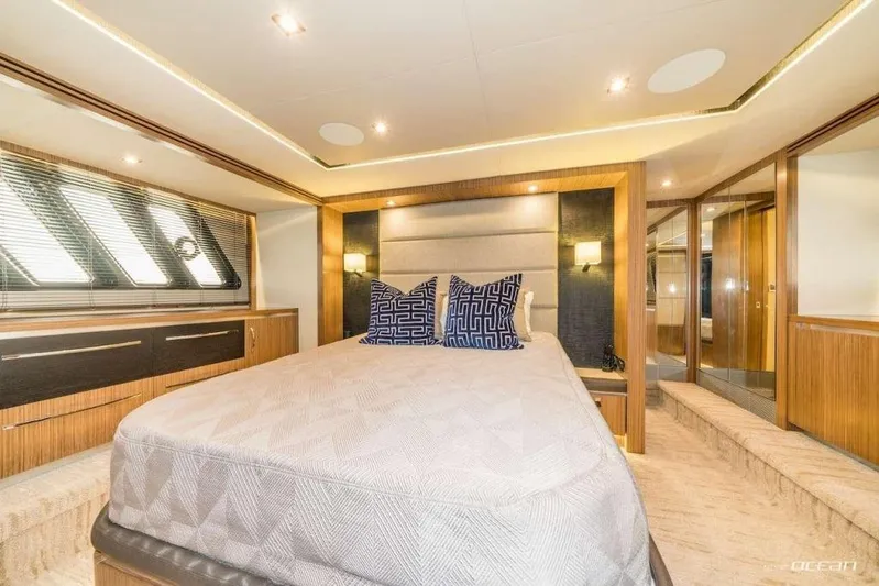  Yacht Photos Pics Luxurious bedroom interior of 2017 Sea Ray L650 Fly yacht with modern design elements.