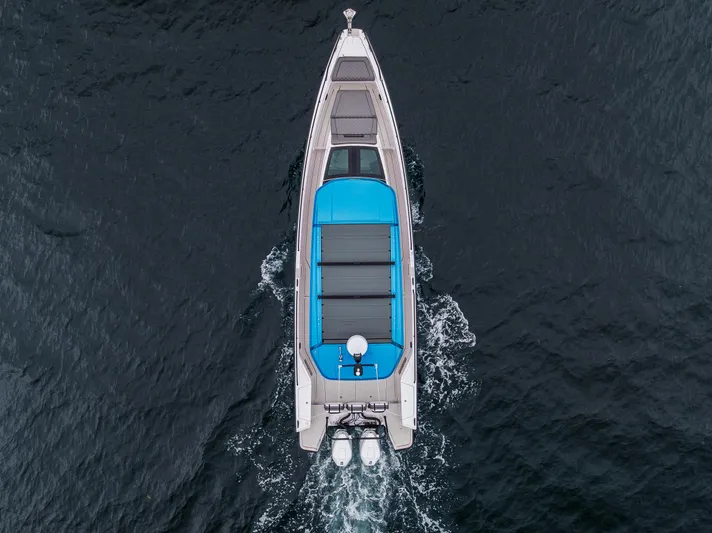 Aqvavit Yacht Photos Pics Aerial view of 2021 Axopar 37xc Wetbar cruising on open water.