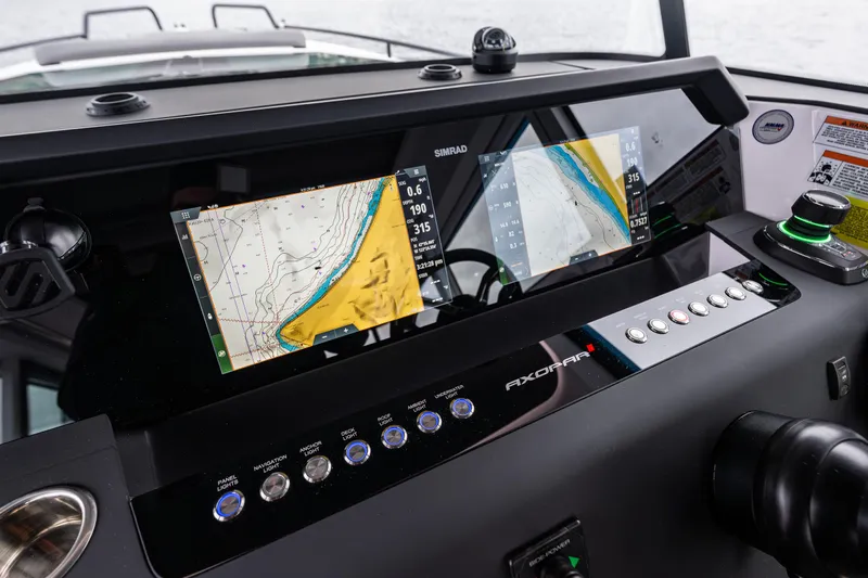 Aqvavit Yacht Photos Pics Dashboard of 2021 Axopar 37xc Wetbar with navigation screens and controls.