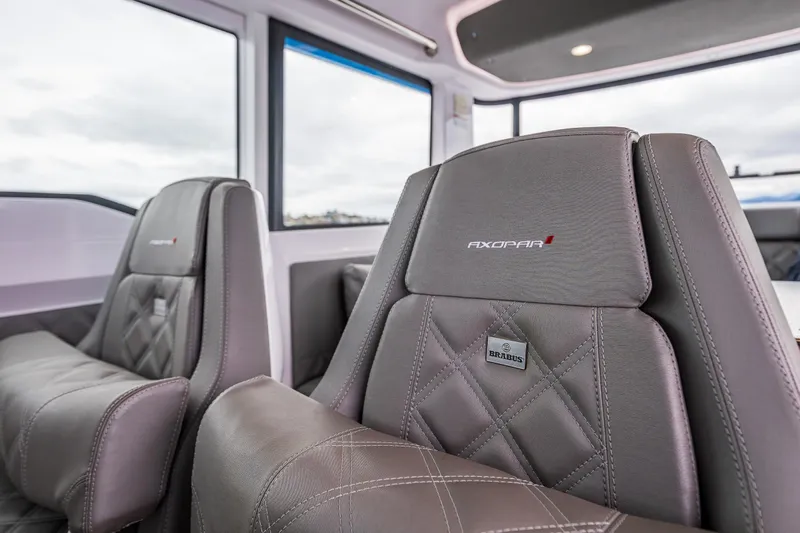 Aqvavit Yacht Photos Pics 2021 Axopar 37xc Wetbar interior with luxurious leather seating.
