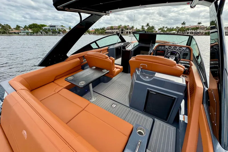  Yacht Photos Pics 2022 Cruisers Yachts 338 South Beach Edition Bow Rider interior with luxurious seating and sleek design.