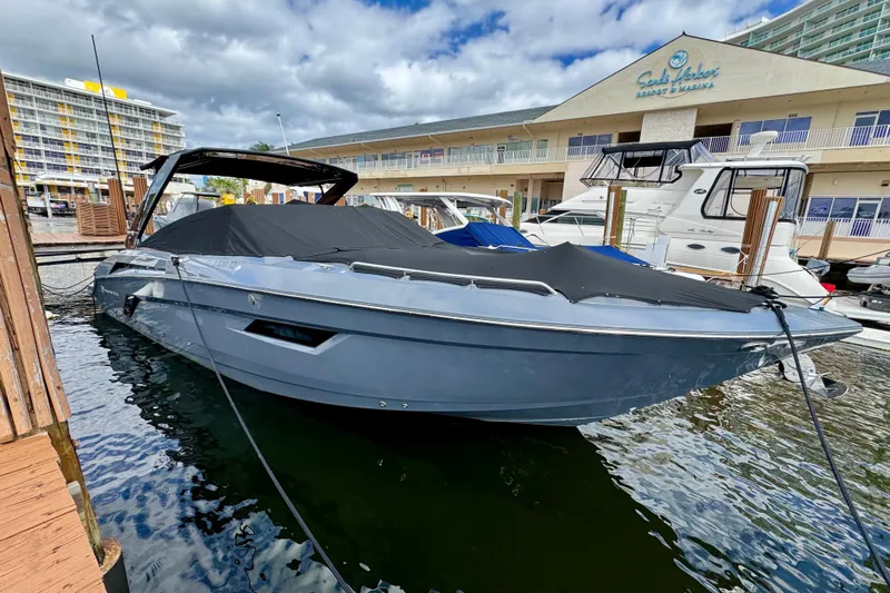 Yacht Photos Pics 2022 Cruisers Yachts 338 South Beach Edition Bow Rider docked at marina.