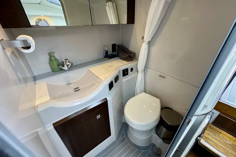  Yacht Photos Pics 2022 Cruisers Yachts 338 South Beach Edition Bow Rider bathroom with modern fixtures.