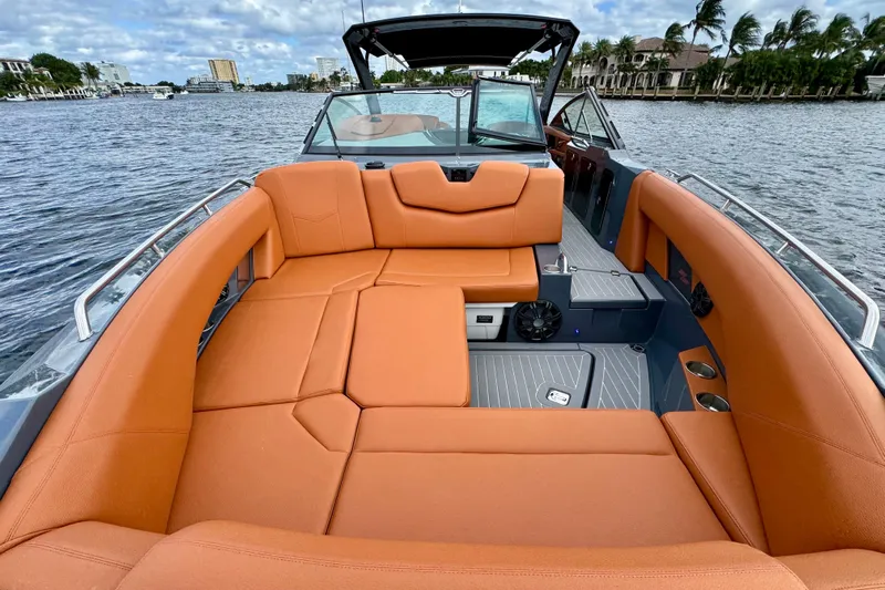  Yacht Photos Pics 2022 Cruisers Yachts 338 South Beach Edition Bow Rider with orange seating on a scenic waterway.