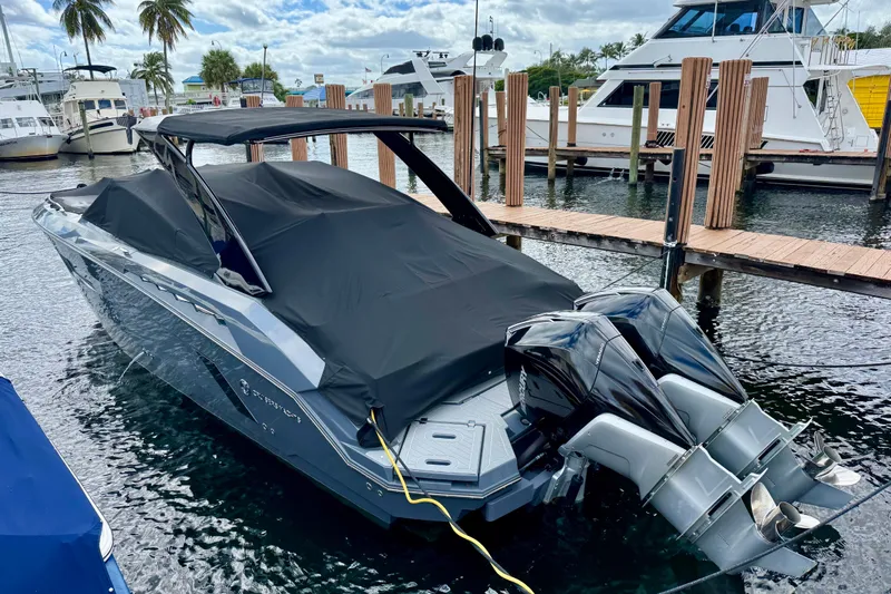  Yacht Photos Pics 2022 Cruisers Yachts 338 South Beach Edition Bow Rider docked with cover.