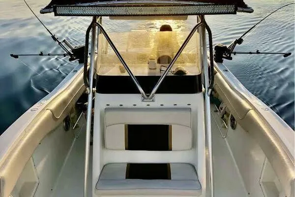  Yacht Photos Pics 2002 Hydra-Sports 2796 CC Vector boat interior with fishing rods at sunset.