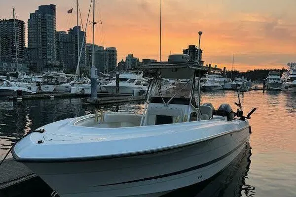  Yacht Photos Pics 2002 Hydra-Sports 2796 CC Vector boat docked at sunset in a marina.