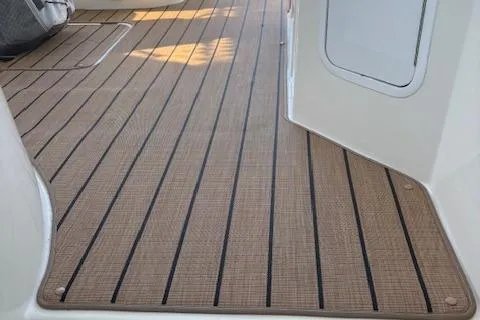  Yacht Photos Pics 2004 Cruisers Yachts 370 Express deck with teak-style flooring.