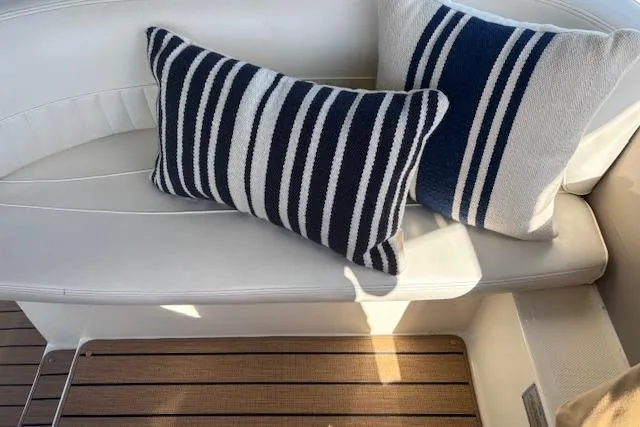  Yacht Photos Pics Striped cushions on white seating in 2004 Cruisers Yachts 370 Express.
