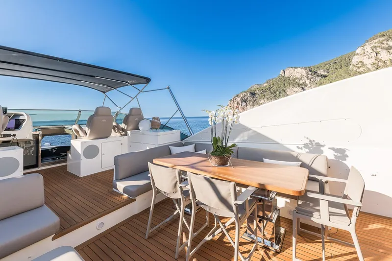 Alacant Yacht Photos Pics Luxurious 2005 Astondoa 102 GLX yacht deck with seating and ocean view.