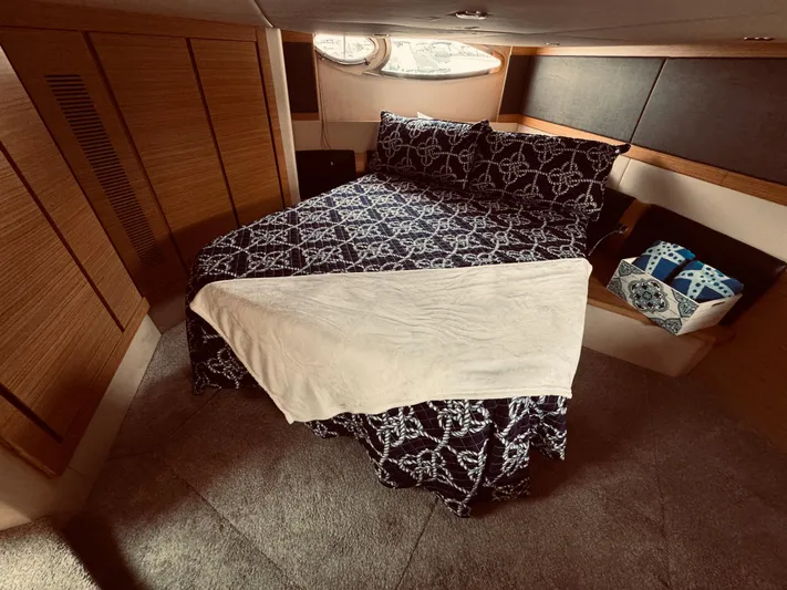  Yacht Photos Pics Luxurious bedroom interior of 2009 Azimut Atlantis 50 yacht with patterned bedding.