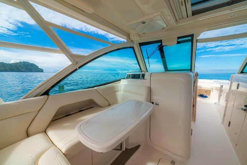 Dos Amigos Yacht Photos Pics Interior of 2020 Grady-White Freedom 375 boat with ocean view and seating area.