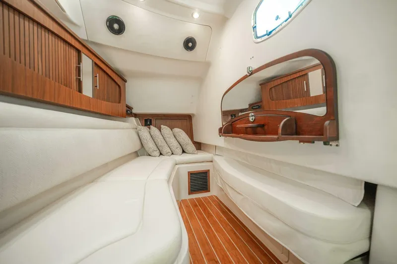 Dos Amigos Yacht Photos Pics Luxurious interior of 2020 Grady-White Freedom 375 boat with elegant wood accents.